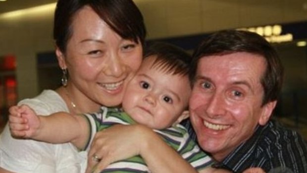 Aidan Fenton as a younger boy with his parents, Geoff and Lily.