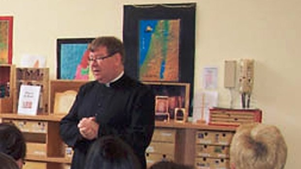 Father John Walshe addressing parents at St Patrick's school in Mentone in 2010. 