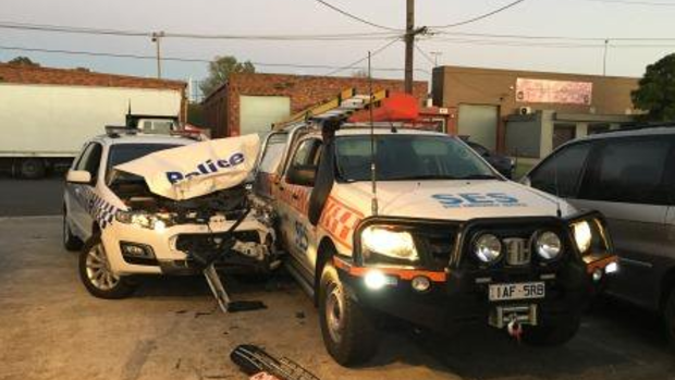 A police car has been extensively damaged after it was rammed with a stolen SES vehicle. 