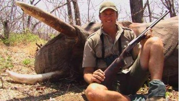 Glenn McGrath posing with a dead elephant.