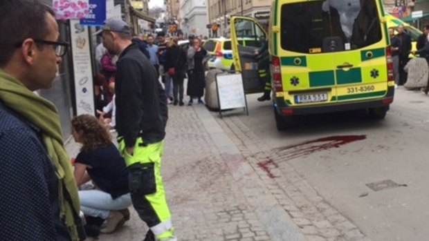 Emergency services tend to the injured in central Stockholm.