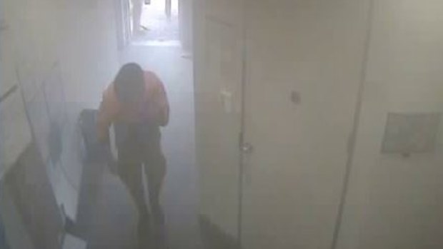 Police have released this footage of a hero tradie who went inside the Springvale bank searching for survivors.
