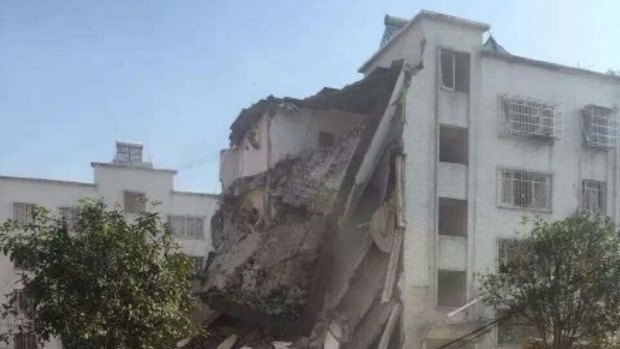 The remains of a government building destroyed by a suspected parcel bomb in Liucheng County, southern China. It was one of 13 targets hit, according to China's official news agency, Xinhua.