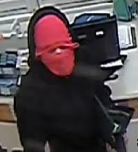 One of the men who robbed Coles in Curtin on Sunday night.