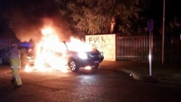 A 4WD engulfed in flames outside the Thornlie Mosque.