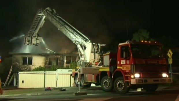 Firefighters battle a blaze at a Logan home.