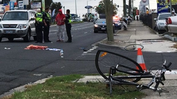 Police at the scene after a cyclist was hit on Sydney Road, Coburg.