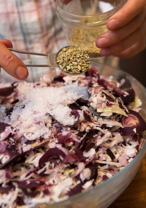 Add salt, spices and herbs to the mixed vegetables.