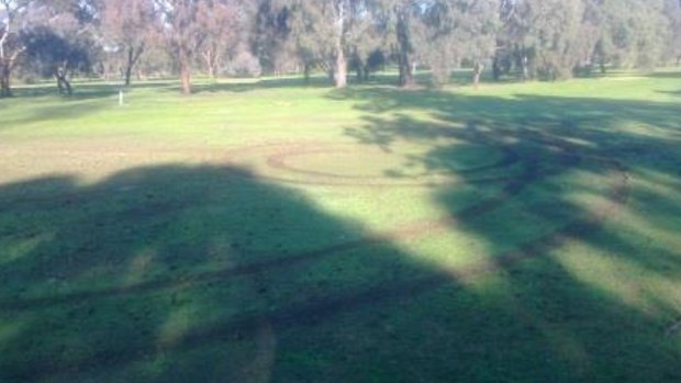 A fairway at the Plenty Road course after the 4WDs ripped up the grass.