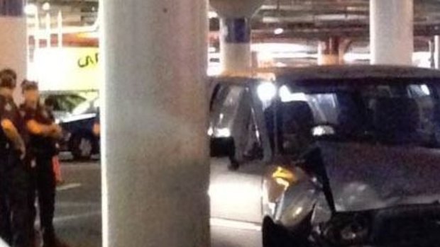 A woman is dead after being trapped under a car at a Brisbane shopping centre.