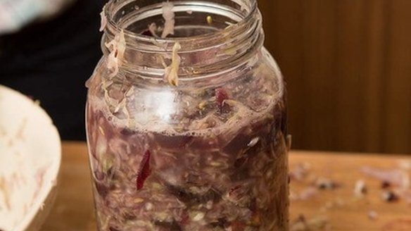 After pressing down, the vegetables should be completely immersed in the liquid with no air bubbles.