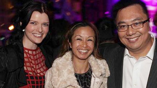 Amber Harrison, left, with former boss Nick Chan and his wife Peggy.