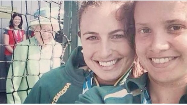 Royal blush: The Queen photobombs the Hockeyroos selfie.