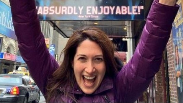 Randi Zuckerberg outside a billboard for the Broadway show in which she featured.