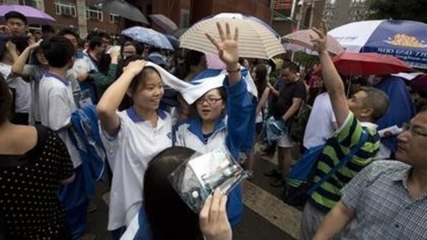 Students file out after the end of college entrance exams in Beijing.