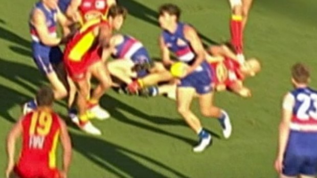 Gold Coast captain Gary Ablett (on the ground) was scrutinised by the match review panel for this off-the-ball blow to Western Bulldogs' Liam Picken.