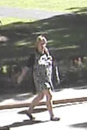Security footage of the woman suspected of setting alight a flag at the Hyde Park war memorial.