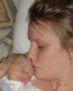 Emma Clark shares a precious moment with her first child, son Khy.