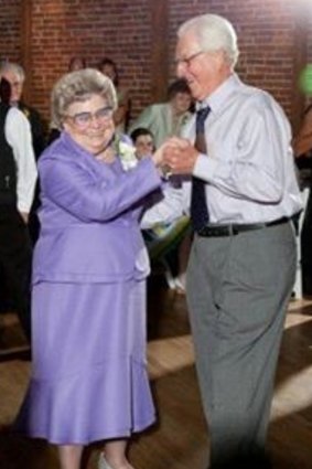 Dolores and Trent Winstead dance at a wedding.