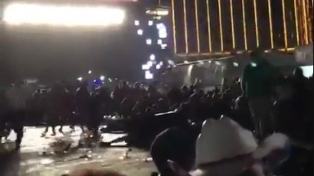 Concertgoers scramble to safety outside the Mandalay Bay Casino. 