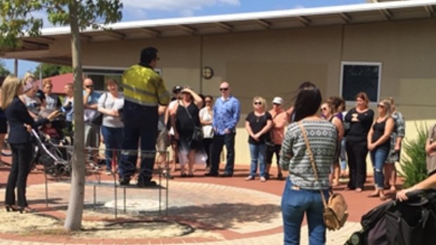 Parents gather to discuss their concerns. 