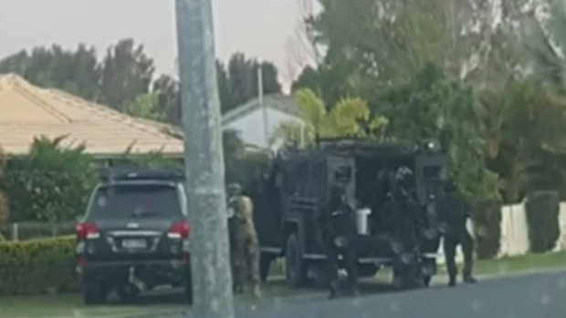 Heavily armed police have surrounded a Morayfield home.
