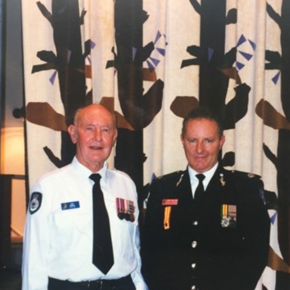Greg Mullins, former Fire and Rescue NSW commissioner, with his father Jack (left).