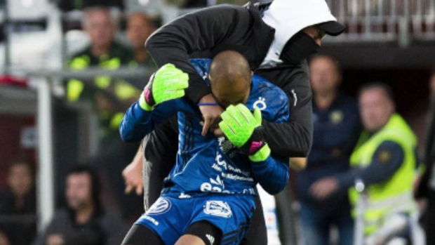 Worrying scenes: Ostersund goalkeeper Aly Keita is attacked on the pitch.