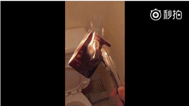 User Pekojima posted a video of a burning Chinese passport. 