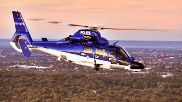 A man has been charged after targeting a police helicopter as it flew over Butler.
