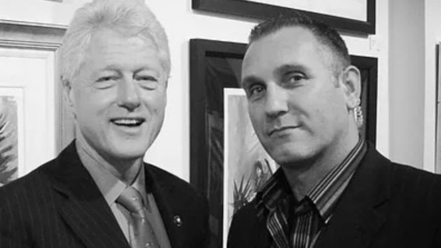 Charged: Security consultant Adrian Gard, pictured with former US president Bill Clinton.