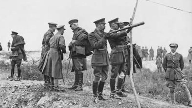 King George V, holding telescope, watching the battle of Pozieres from captured ground. The Prince of Wales is behind the King talking to two officers.