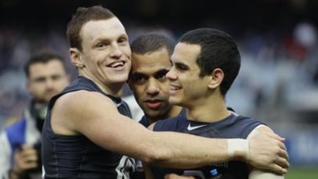 Mitch Robinson (left) and Jeff Garlett (right) celebrate during a Carlton win in 2011.