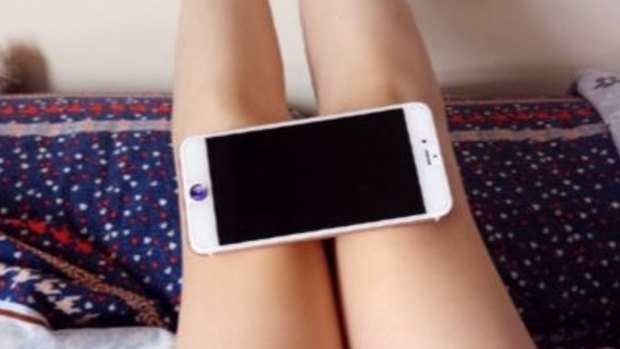 The iPhone 6 knee challenge to demonstrate how slim your legs are.