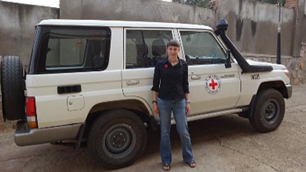 Katrina Elliot with a Red Cross aid vehicle.