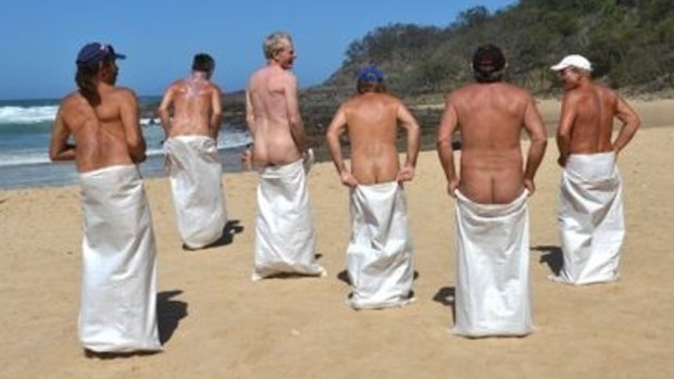Competitors enjoy the sack race during Nudist Day at Alexandria Beach.