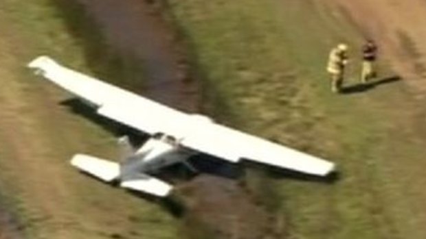 A plane lies to the side of a runway at Redcliffe Airport at Rothwell.