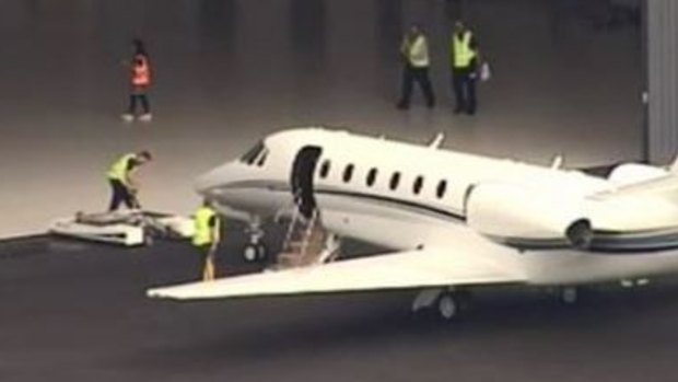 A plane arrives at Brisbane Airport with Australian victims of the bus crash in Vanuatu.