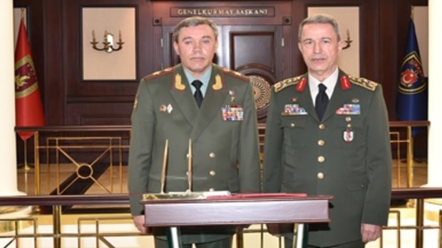 Military officials meet to discuss "regional security" issues: Turkey's Chief of Staff Gen. Hulusi Akar, right, and his Russian counterpart Gen. Valery Gerasimov.
