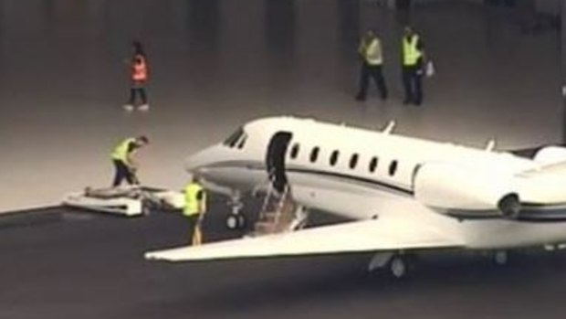 A plane arrives at Brisbane Airport with Australian victims of the bus crash in Vanuatu.