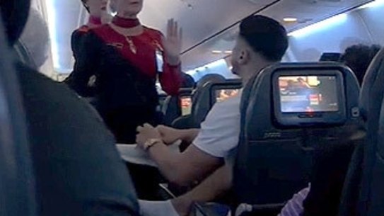 A Qantas passenger has been banned by the airline for 12 months following an altercation on board that went viral on TikTok.