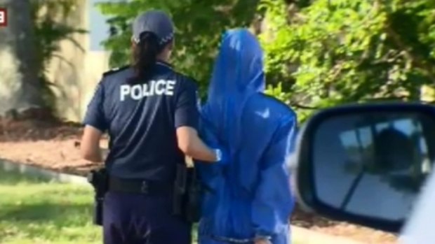 A woman is questioned by police before being released after a shooting on the Gold Coast. 