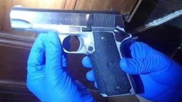 A pistol seized in the raid.