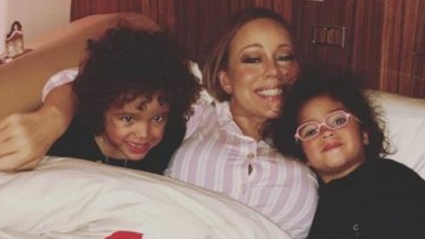 "So young": Mariah Carey has not yet told her twins Monroe and Moroccan, 4, that James Packer will be their stepfather.