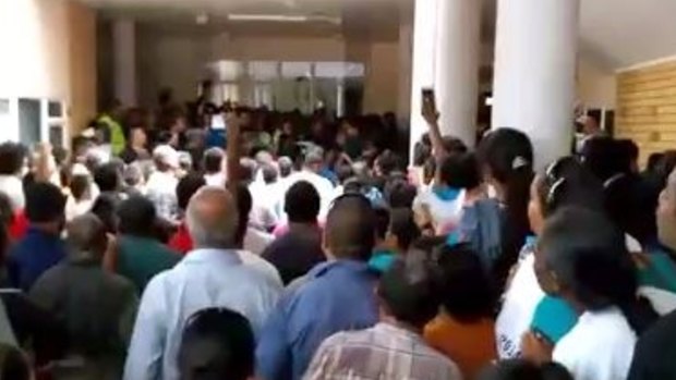 People protest against corruption in Nauru's parliament on Tuesday.