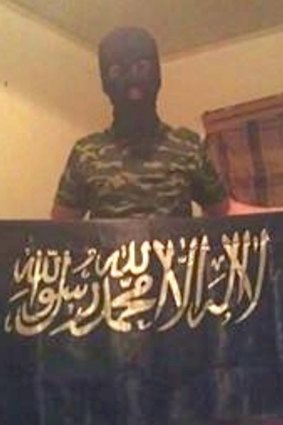 Five days before the attack, Haider posted a photograph on Facebook of himself wearing a balaclava and holding the Shahada flag.