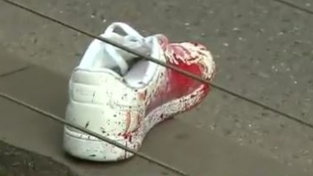 A bloodied shoe at the scene of the stabbing.