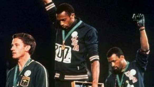 Australia's Peter Norman (left) joins American athletes Tommie Smith and John Carlos on the podium during the famous "Black Power" demonstration.