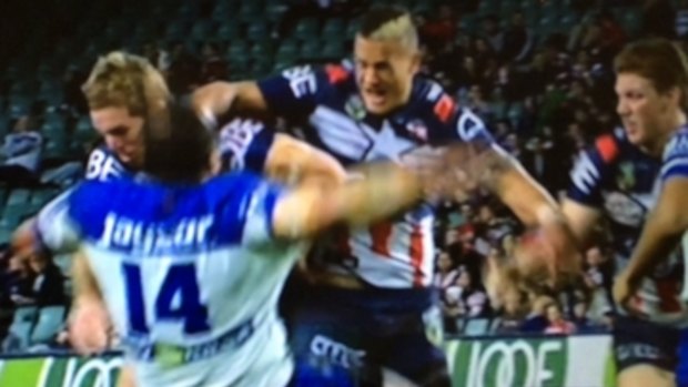 The incident: Bulldogs prop Sam Kasiano hits the deck after a Kane Evans shoulder charge.