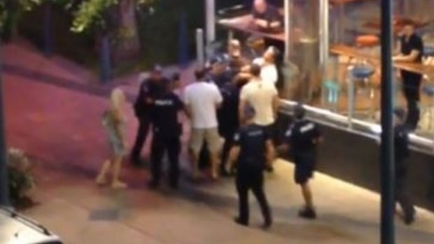 A screenshot of the footage of Ray Currier's arrest, in which he appears to be struck several times by police.